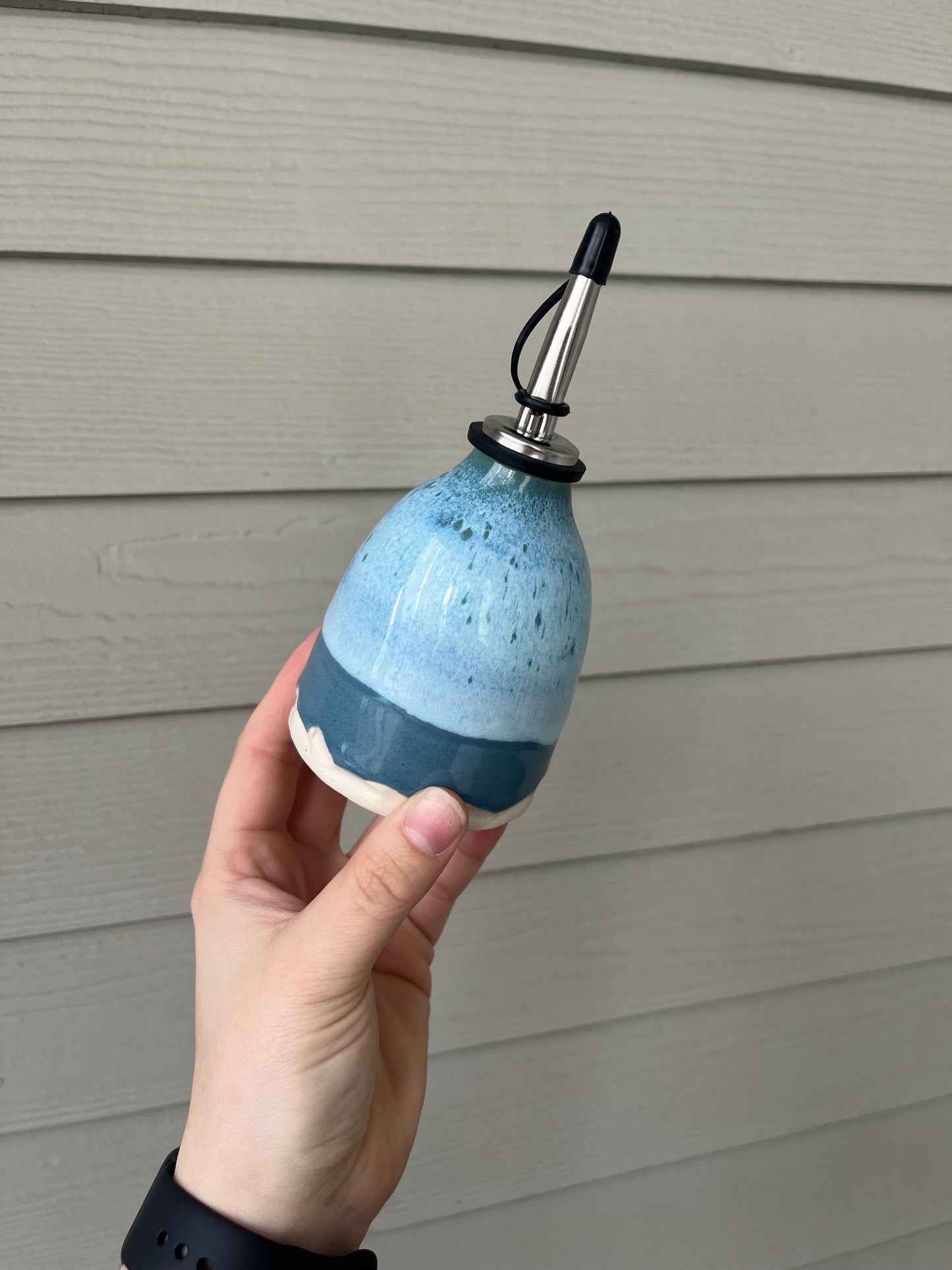 blue cloud oil bottle