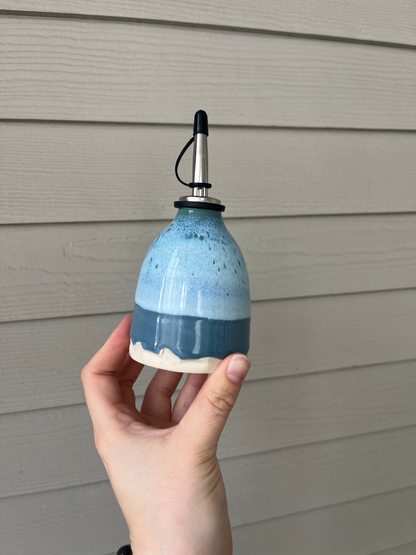 blue cloud oil bottle