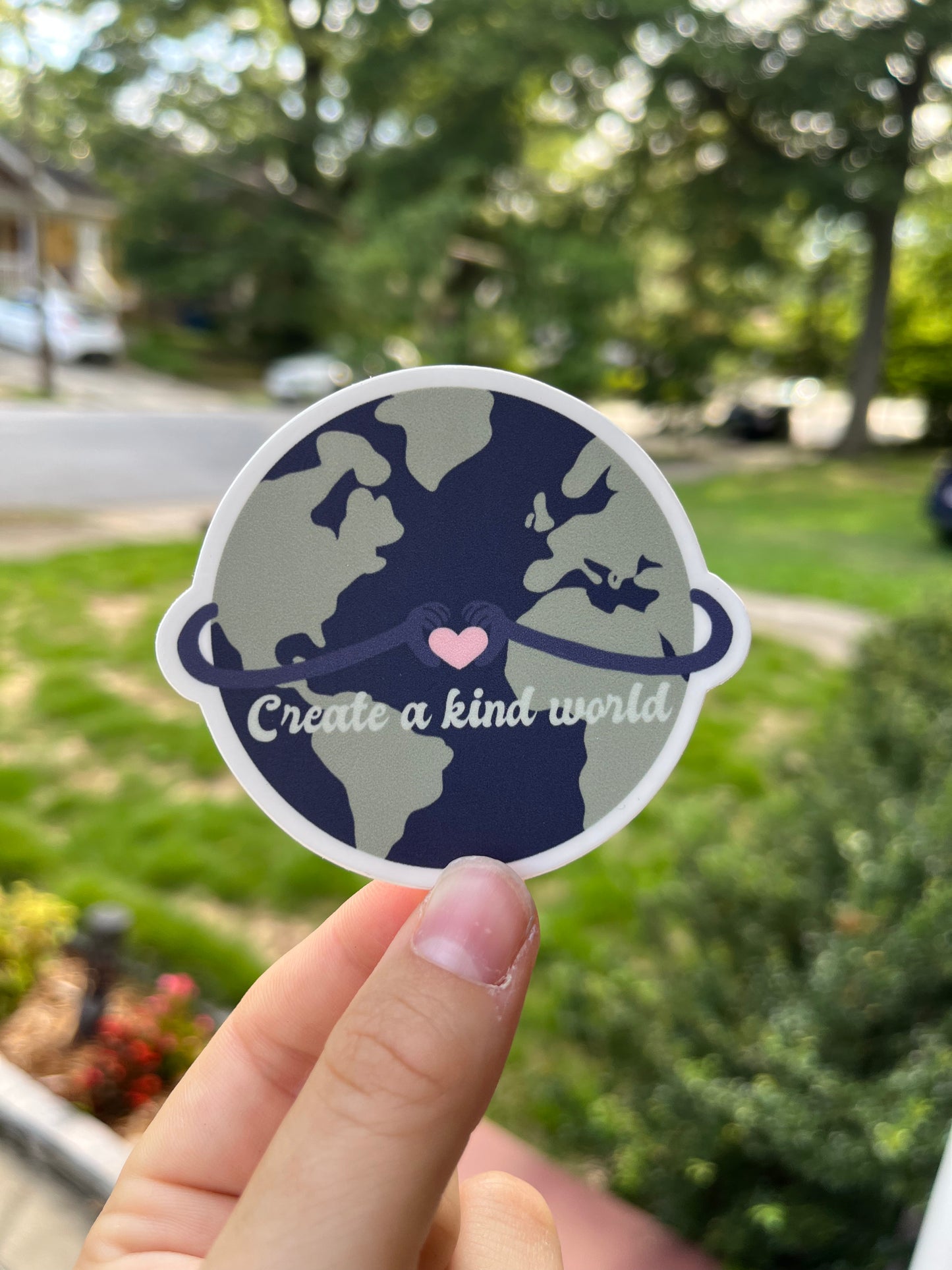 create a kind world sticker