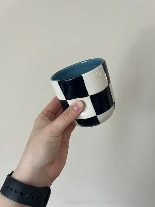 black checkered thumb cup A